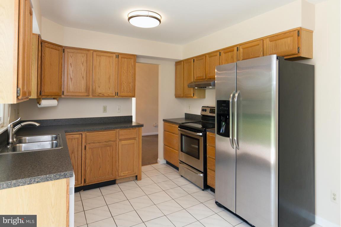 2209 Furnace Road Fallston, MD 21047 - Photo 10 of 30 a kitchen with granite countertop a refrigerator and a sink