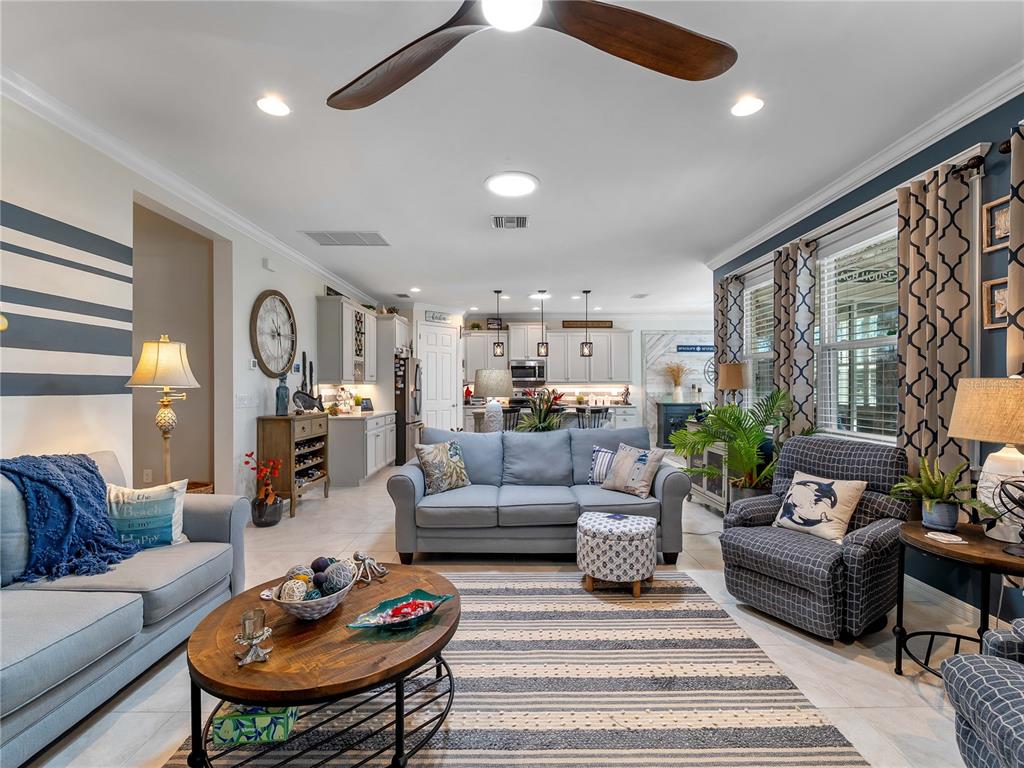 8228 Walbert Street Port Charlotte, FL 33981 - Photo 22 of 66 a living room with furniture potted plant and a table
