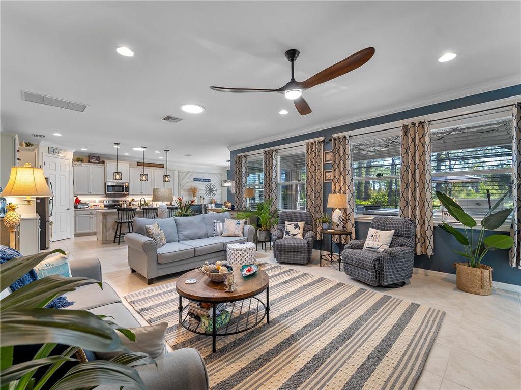 8228 Walbert Street Port Charlotte, FL 33981 - Photo 23 of 66 a living room with furniture and a large window
