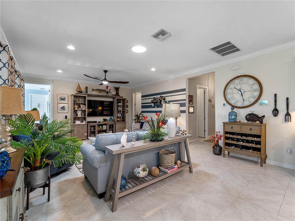 8228 Walbert Street Port Charlotte, FL 33981 - Photo 25 of 66 a living room with furniture gym equipment and a large mirror