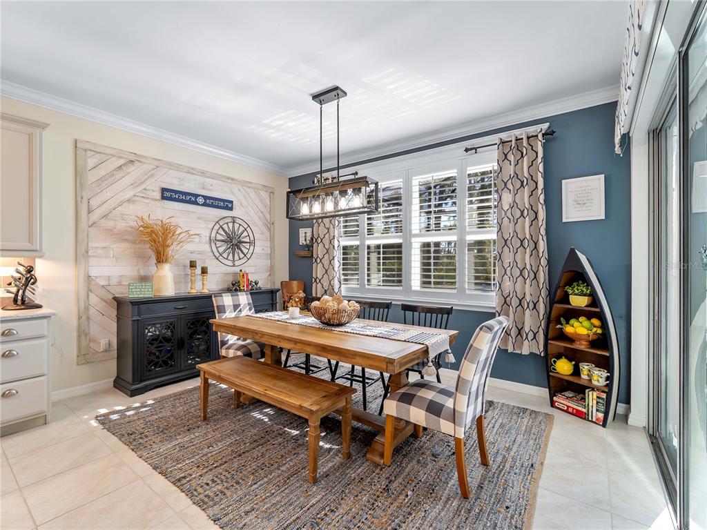 8228 Walbert Street Port Charlotte, FL 33981 - Photo 32 of 66 a living room with furniture a rug and a chandelier