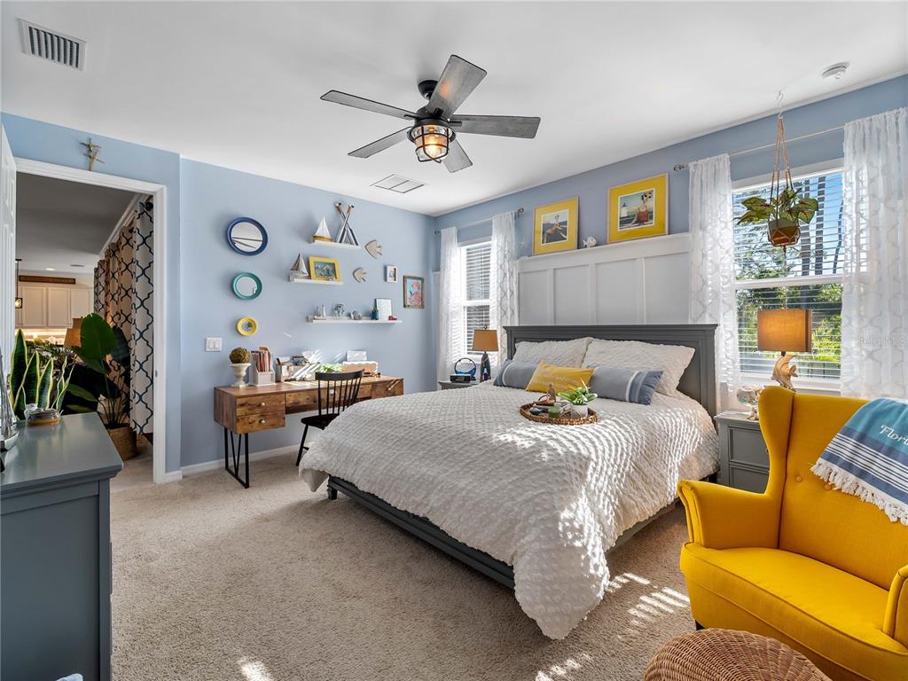 8228 Walbert Street Port Charlotte, FL 33981 - Photo 34 of 66 a bedroom with a bed and ceiling fan