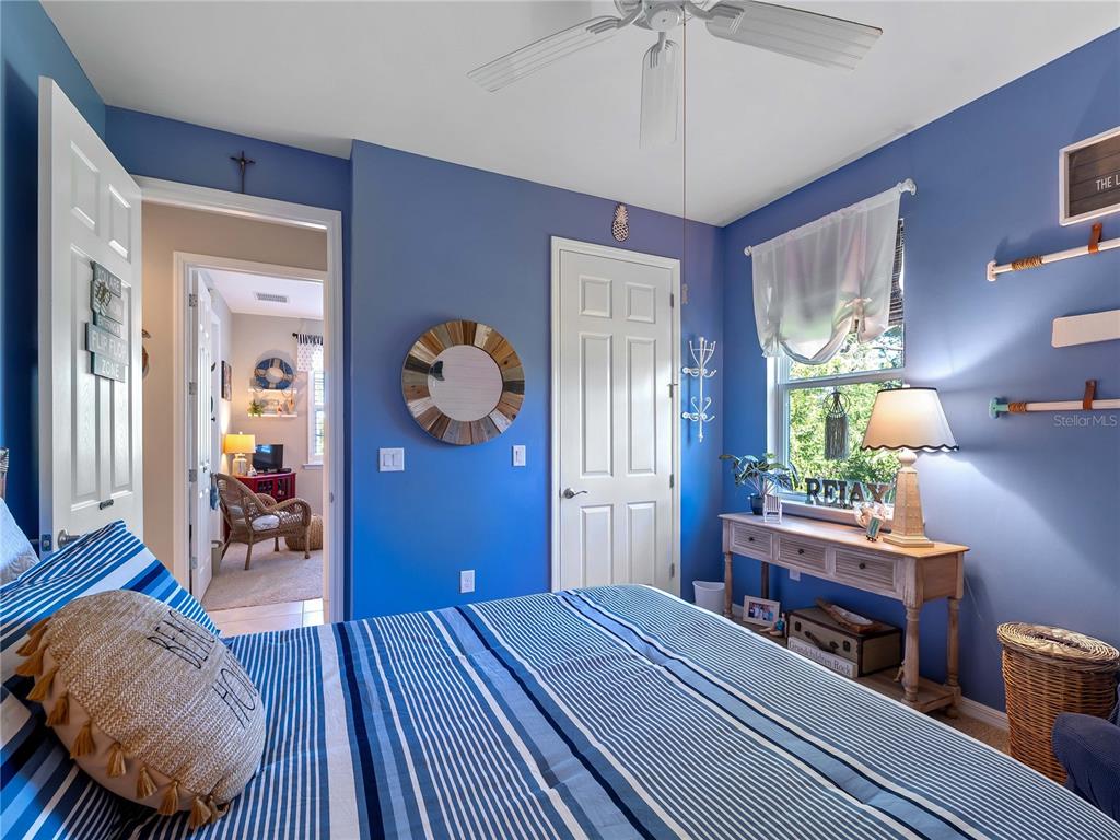 8228 Walbert Street Port Charlotte, FL 33981 - Photo 39 of 66 a bedroom with a bed and wooden floor