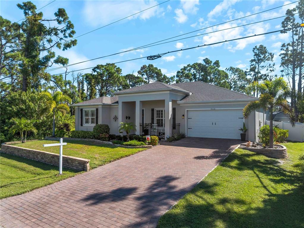 8228 Walbert Street Port Charlotte, FL 33981 - Photo 8 of 66 a front view of a house with swimming pool