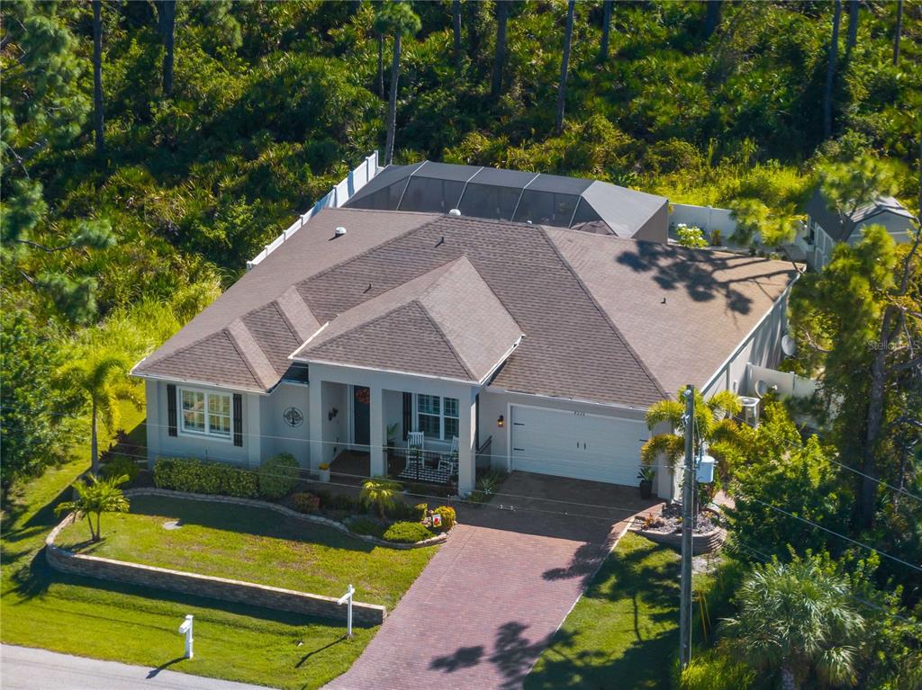 8228 Walbert Street Port Charlotte, FL 33981 - Photo 10 of 66 an aerial view of a house with swimming pool garden and patio