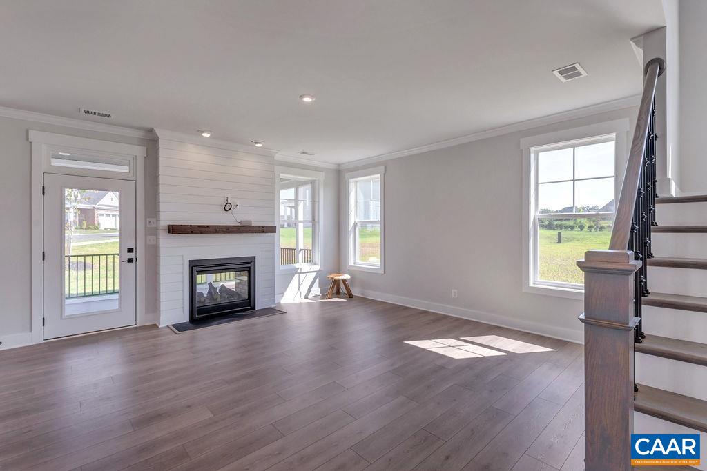 313 Sunbird Lane Waynesboro, VA 22980 - Photo 13 of 45 a view of an empty room with wooden floor and a window