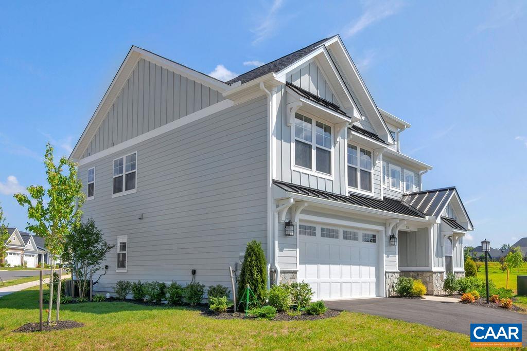 313 Sunbird Lane Waynesboro, VA 22980 - Photo 2 of 45 a front view of a house with a yard and garage