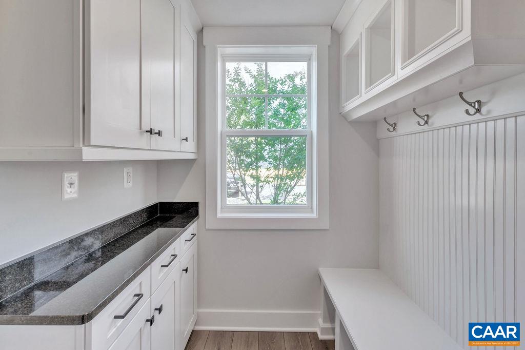313 Sunbird Lane Waynesboro, VA 22980 - Photo 23 of 45 a kitchen with granite countertop white cabinets and a window