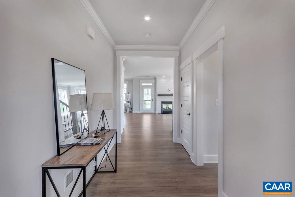 313 Sunbird Lane Waynesboro, VA 22980 - Photo 6 of 45 a view of a hallway with wooden floor and furniture