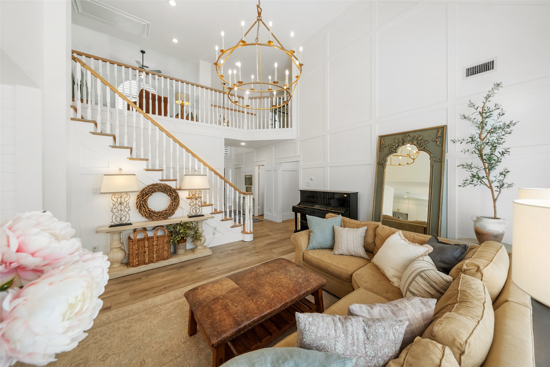 18 South Dragonwood Place Spring, TX 77381 - Photo 14 of 50 a living room with furniture a fireplace and a chandelier
