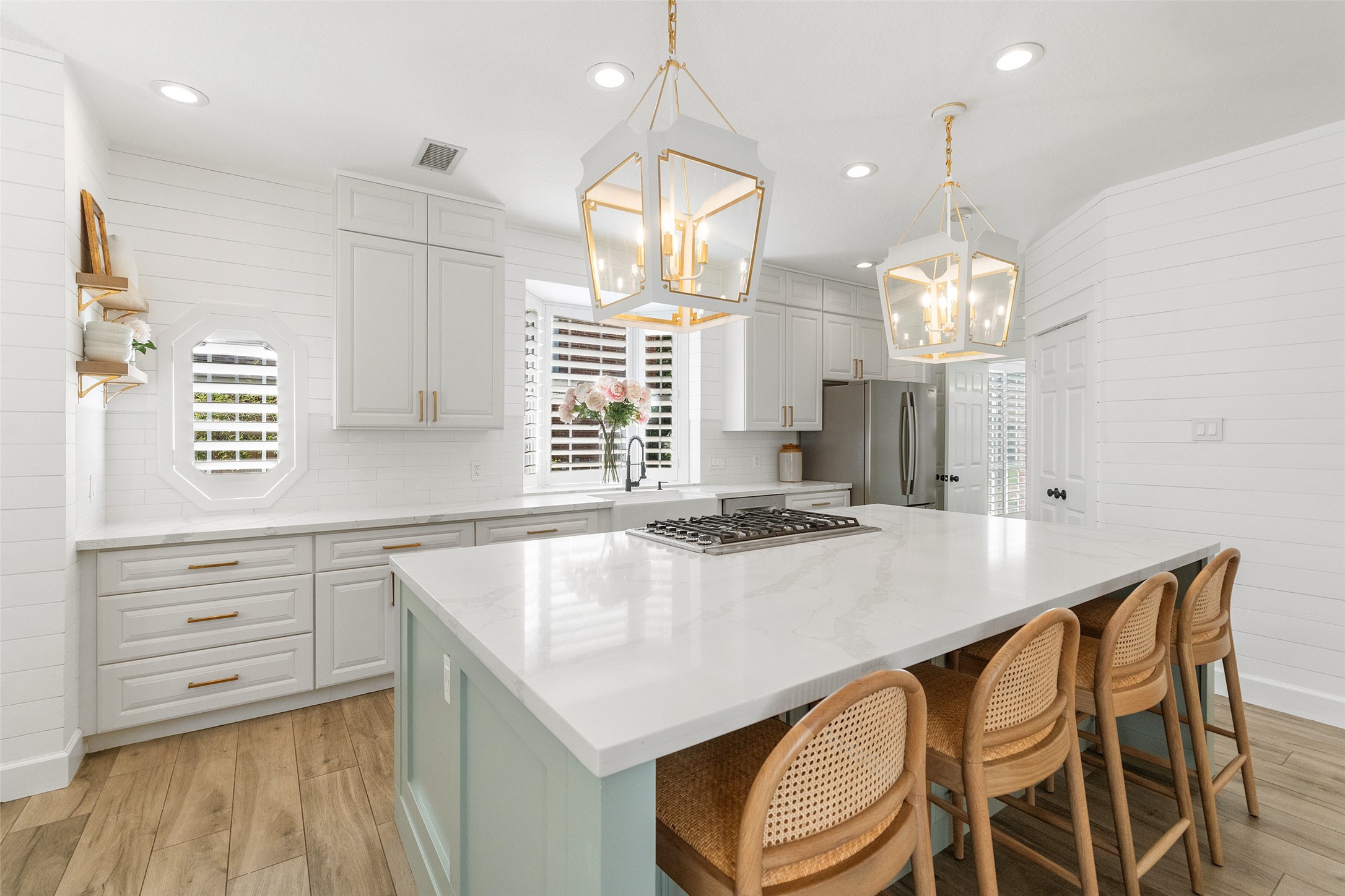 18 South Dragonwood Place Spring, TX 77381 - Photo 19 of 50 a kitchen with a table chairs stove and cabinets