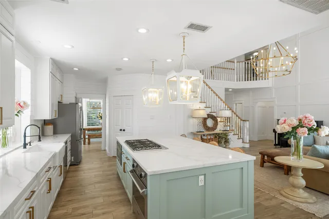 a kitchen that has a lot of cabinets in it