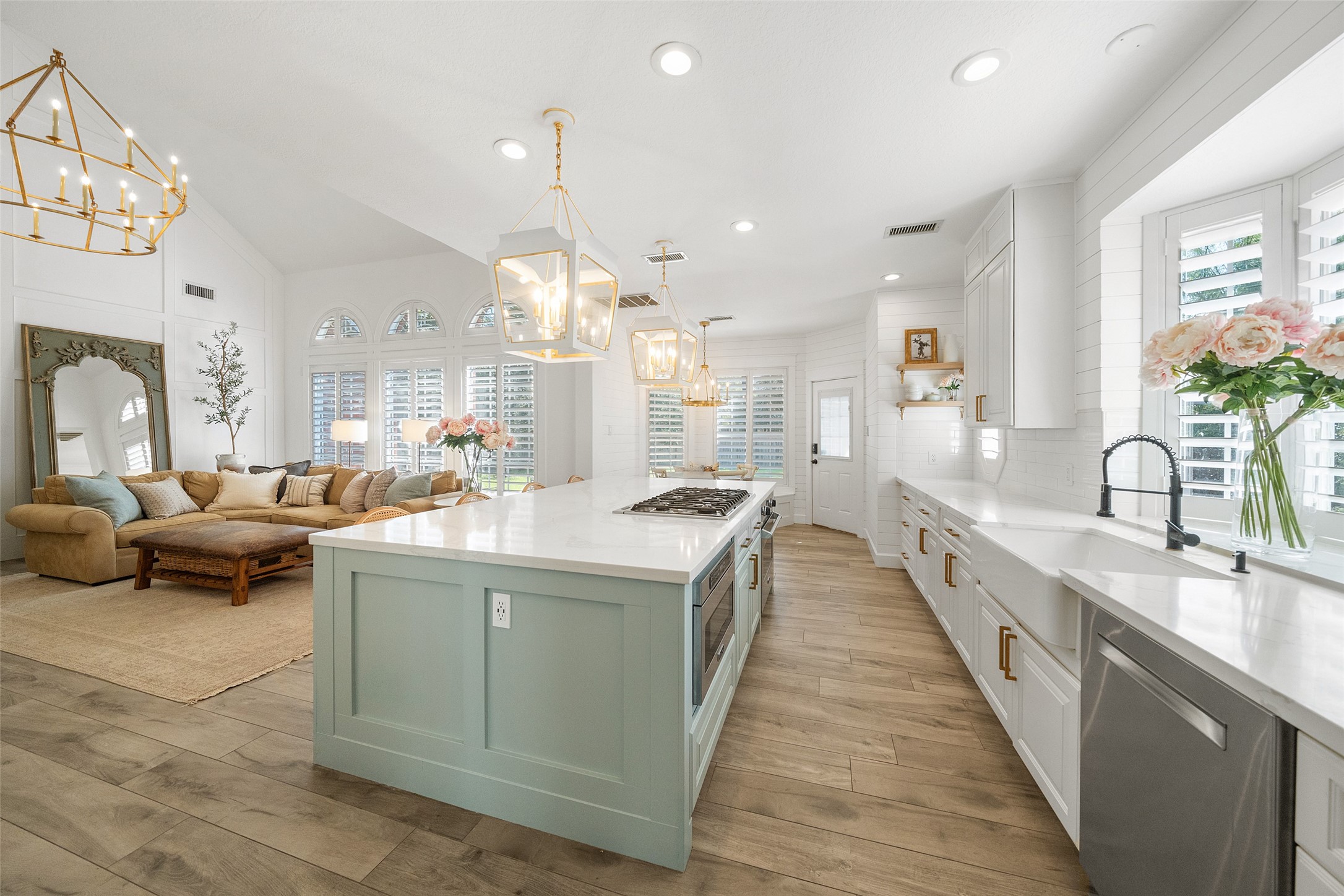 18 South Dragonwood Place Spring, TX 77381 - Photo 23 of 50 a large kitchen with kitchen island a large counter space a sink a window and stainless steel appliances
