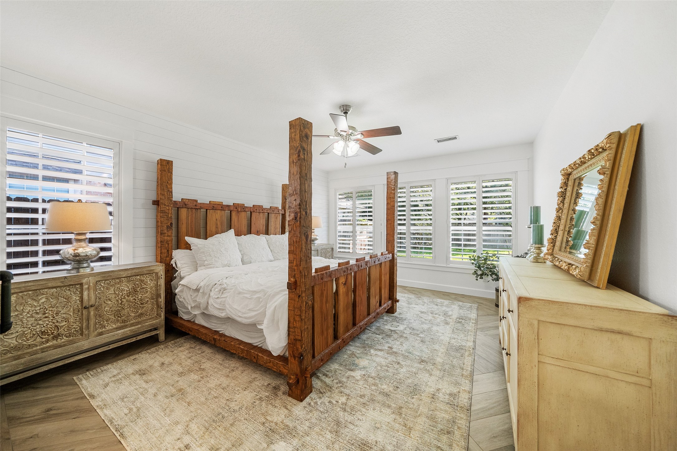 18 South Dragonwood Place Spring, TX 77381 - Photo 27 of 50 a bedroom with a bed and large flat screen tv