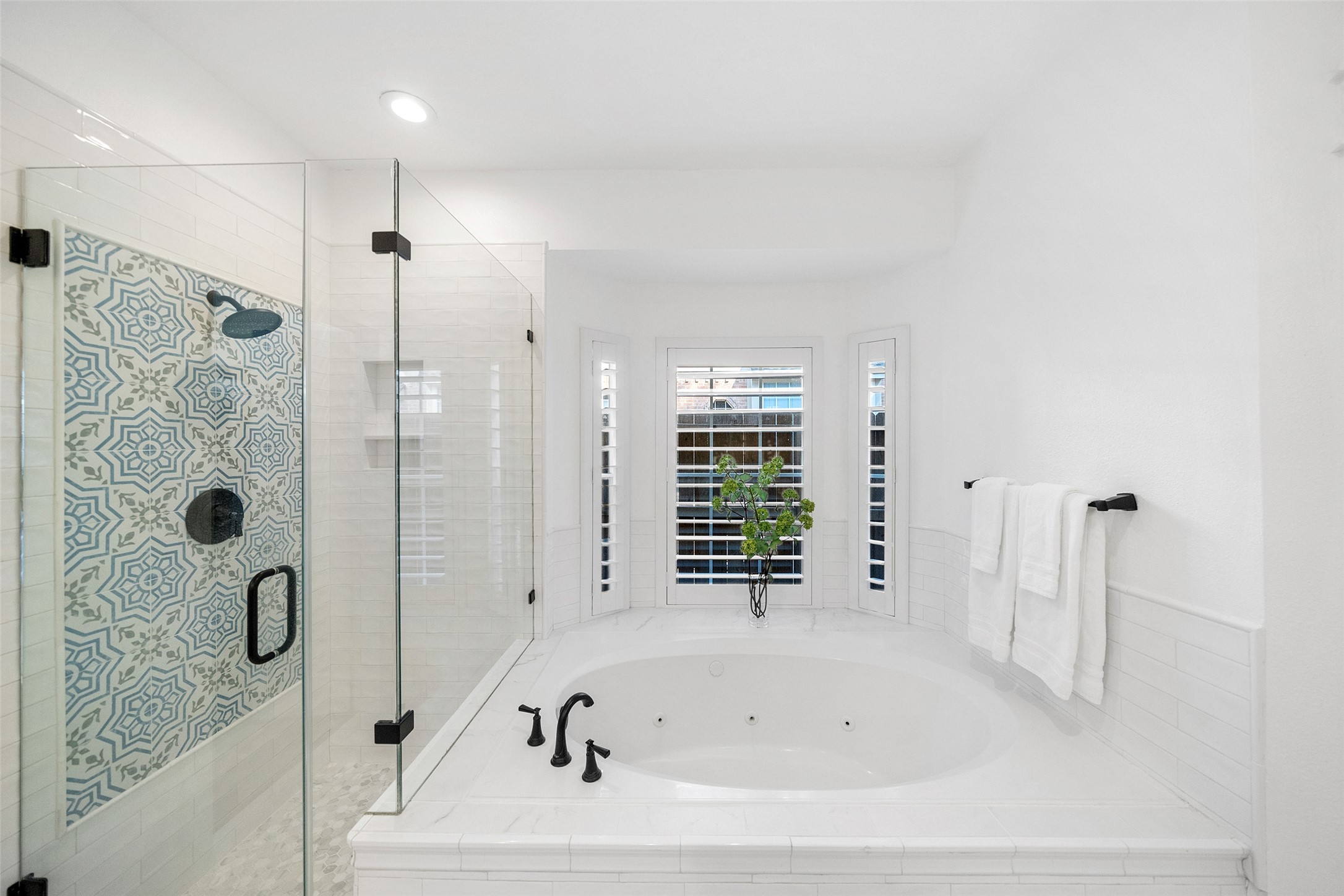 18 South Dragonwood Place Spring, TX 77381 - Photo 30 of 50 a bathroom with a bathtub a shower and a shower