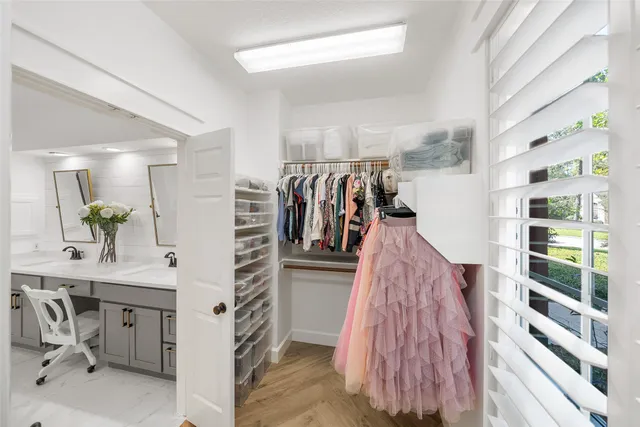 a room with wooden floor and a window