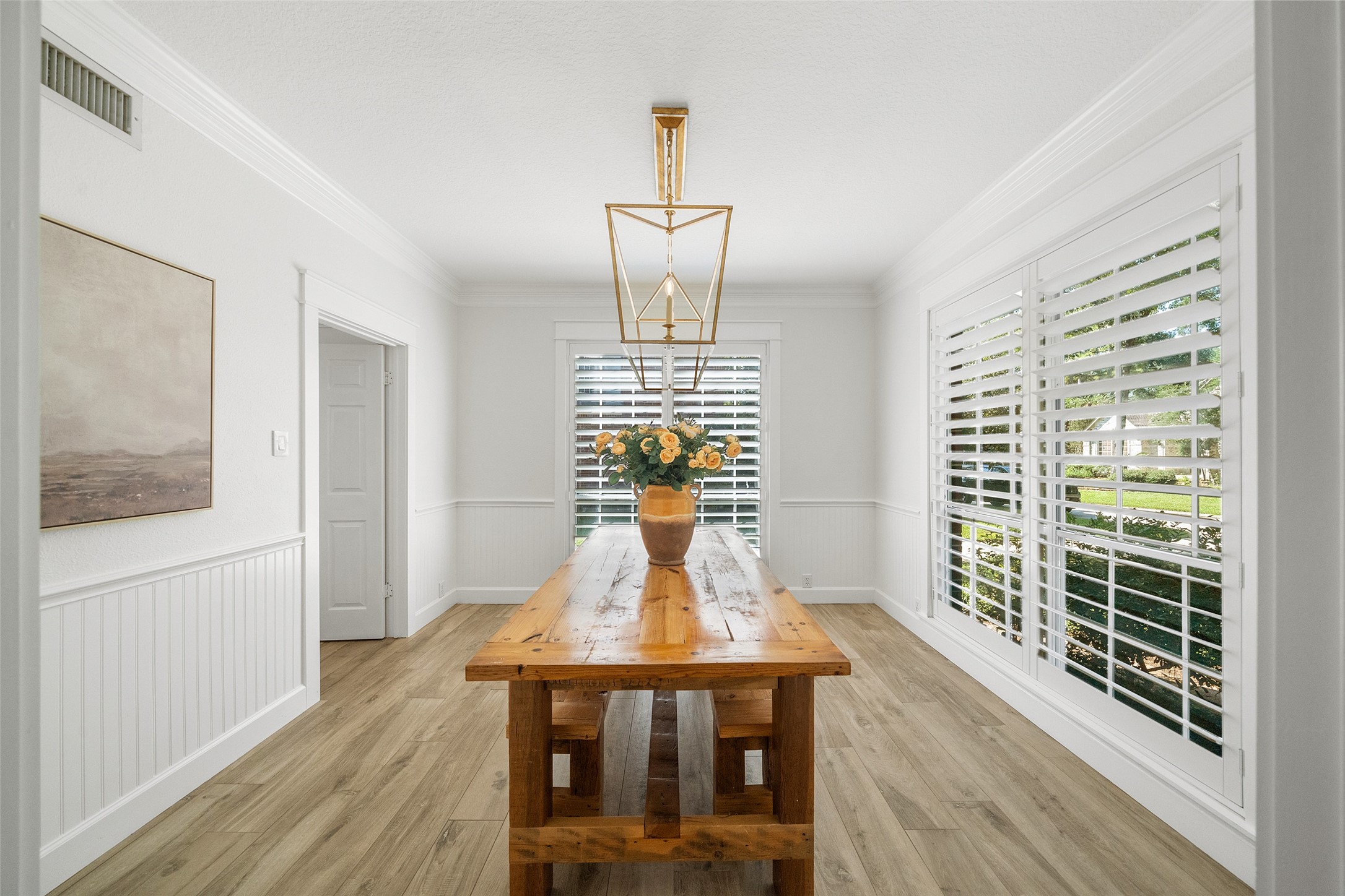 18 South Dragonwood Place Spring, TX 77381 - Photo 34 of 50 a view of a dining room with furniture window and wooden floor