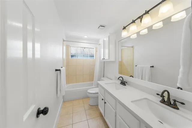 a bedroom with a bed and dresser