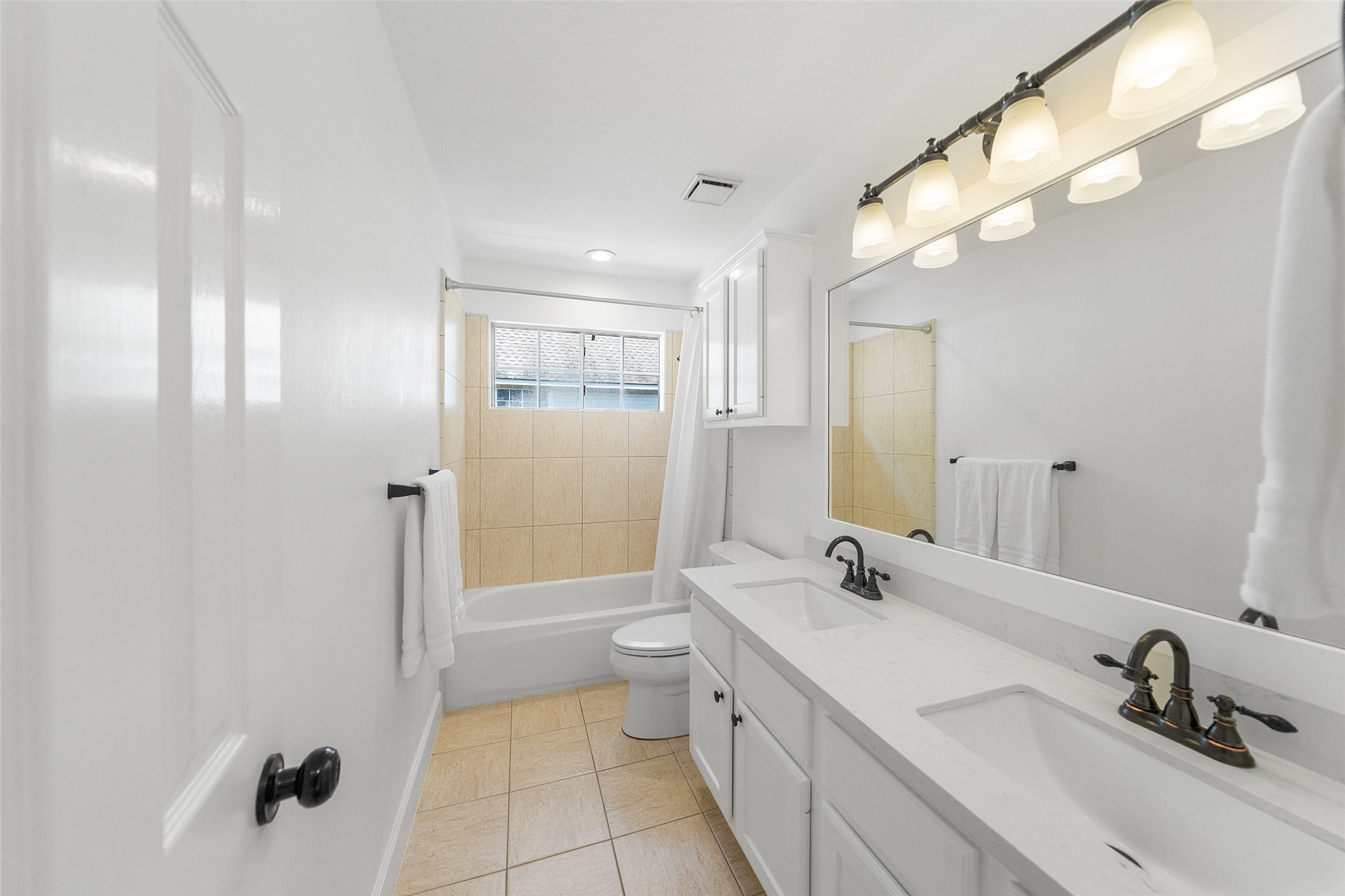 18 South Dragonwood Place Spring, TX 77381 - Photo 42 of 50 a bathroom with a double vanity sink mirror and toilet