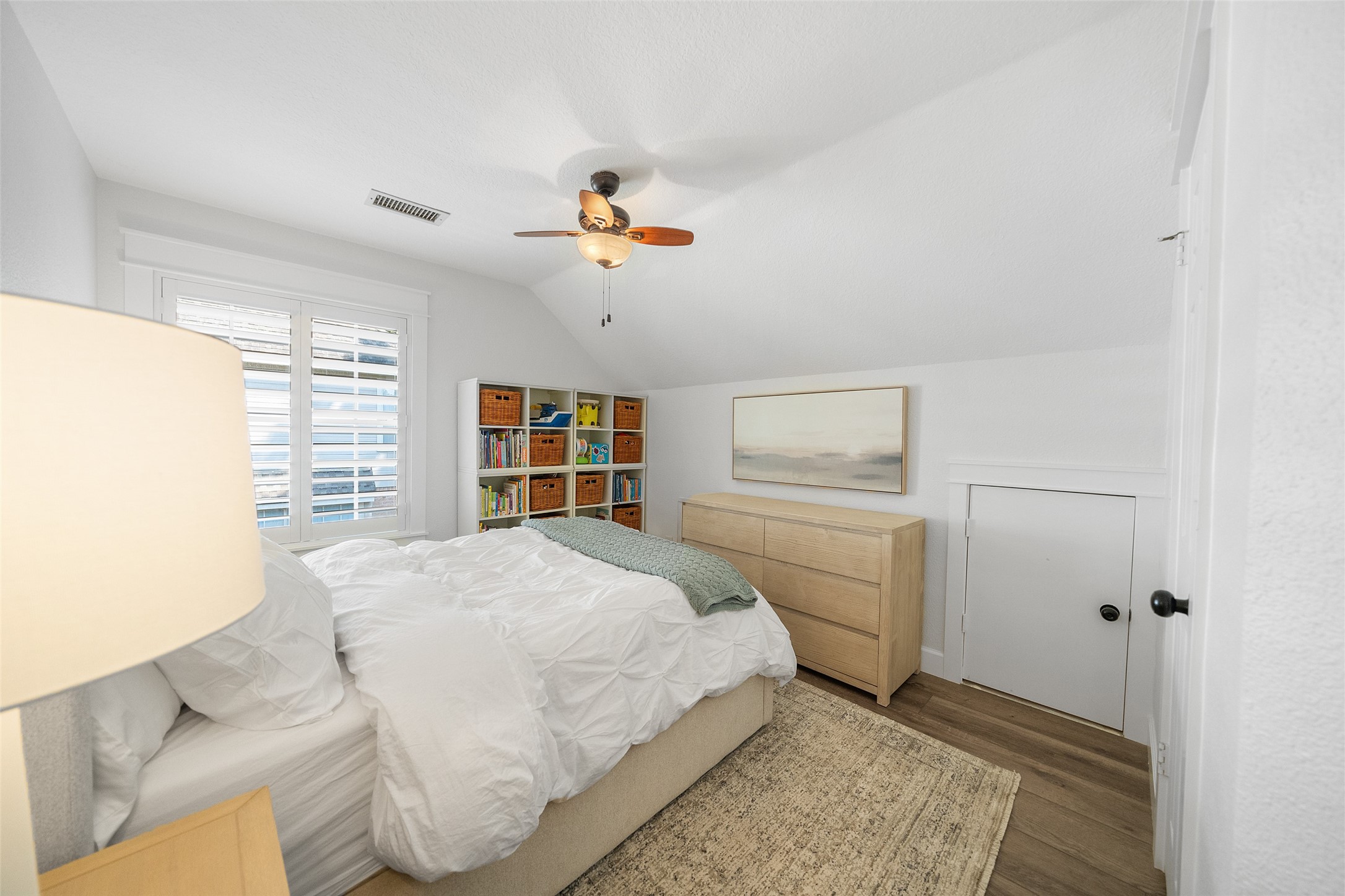 18 South Dragonwood Place Spring, TX 77381 - Photo 43 of 50 a bedroom with a bed and dresser