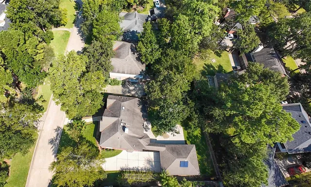 an aerial view of multiple houses with yard