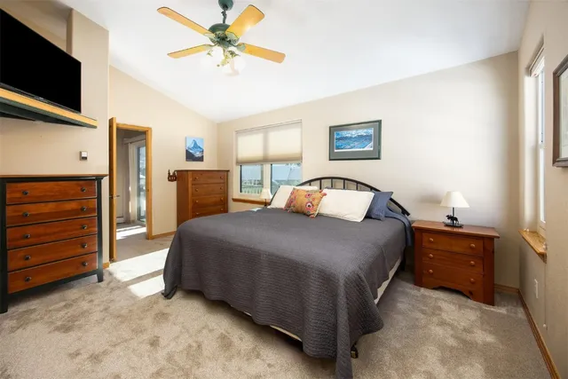 a bedroom with a bed and a tv