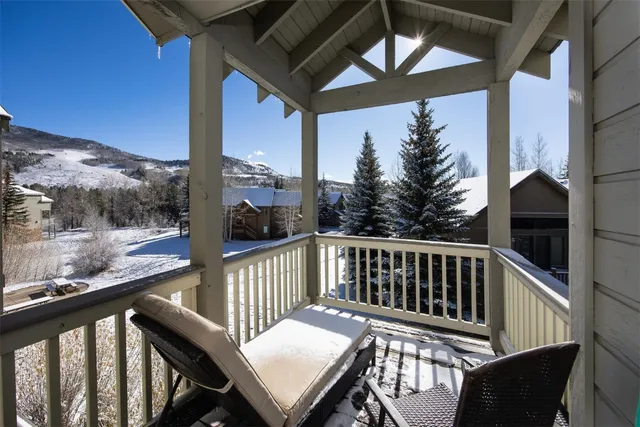 a view of a big house with a mountain in the background