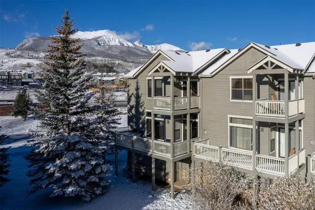 a view of a house with a backyard space and balcony