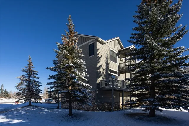 a view of a house with a mountain in the background