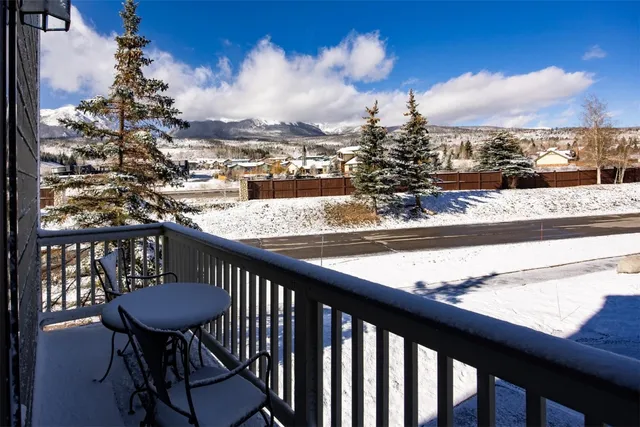 a view of a balcony with an outdoor seating