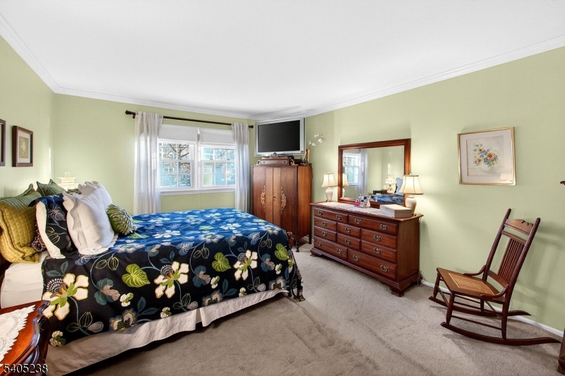 6 Phoenix Drive Mendham, NJ 07945 - Photo 11 of 23 a bedroom with bed and window