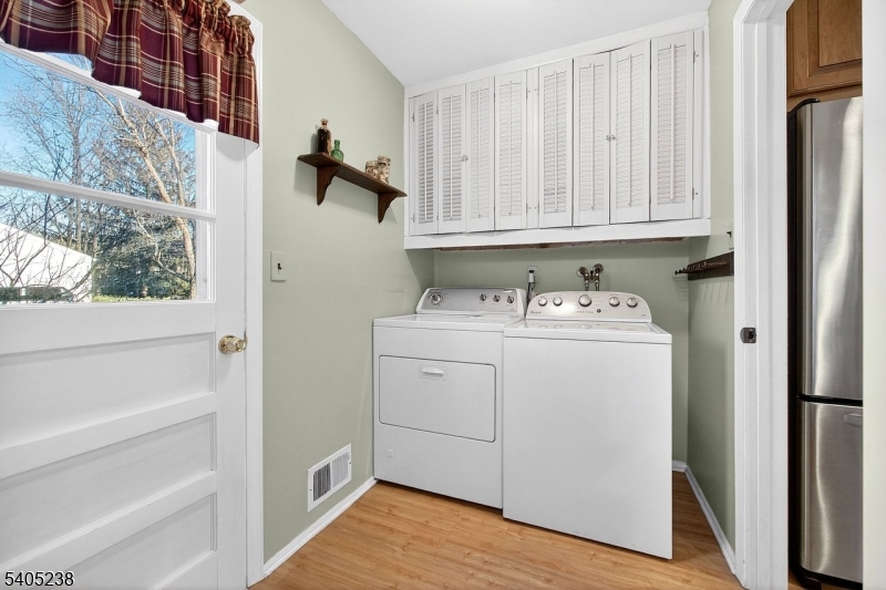 6 Phoenix Drive Mendham, NJ 07945 - Photo 15 of 23 a utility room with dryer and washer