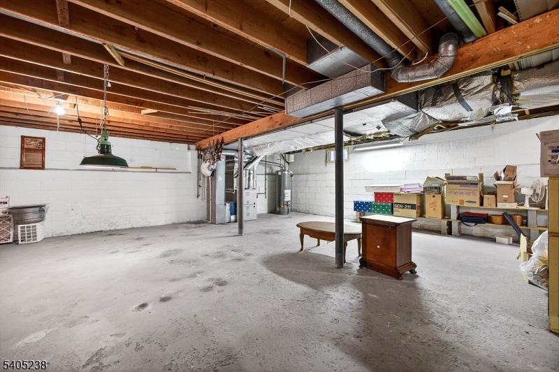6 Phoenix Drive Mendham, NJ 07945 - Photo 16 of 23 a view of a garage with table and chairs