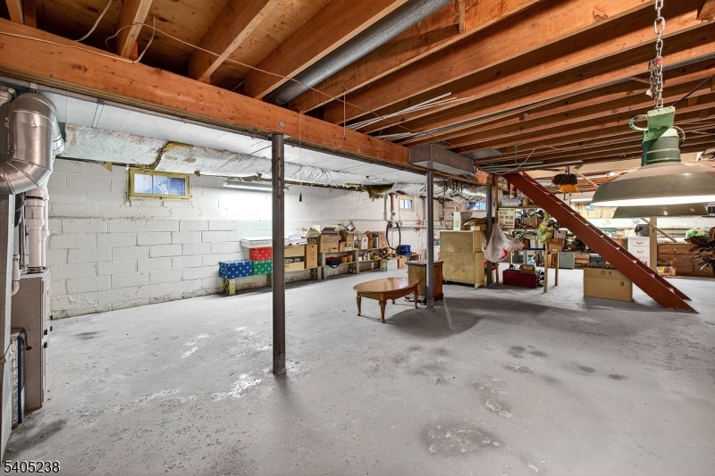 6 Phoenix Drive Mendham, NJ 07945 - Photo 17 of 23 a view of a patio with table and chairs