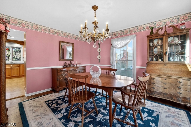 6 Phoenix Drive Mendham, NJ 07945 - Photo 6 of 23 a view of a dining room with furniture and chandelier