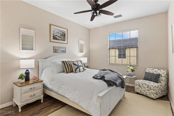 a bedroom with bed and window