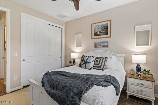 a bedroom with a bed and cupboard
