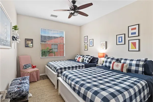 a bedroom with a bed and window