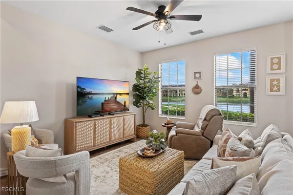 a living room with furniture and a window