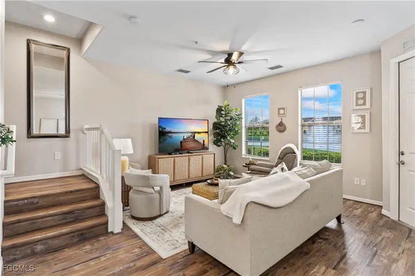 a living room with furniture and a large window
