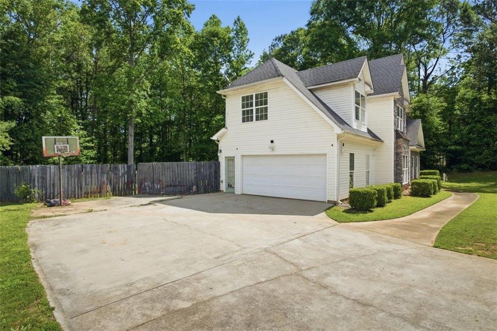 1231 Hillview Road Hampton, GA 30228 - Photo 33 of 49 a white house that has tree in front of it