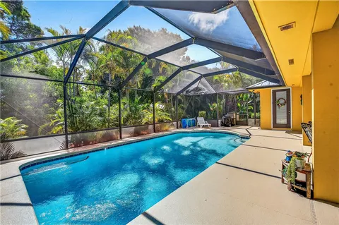 a view of swimming pool with a patio