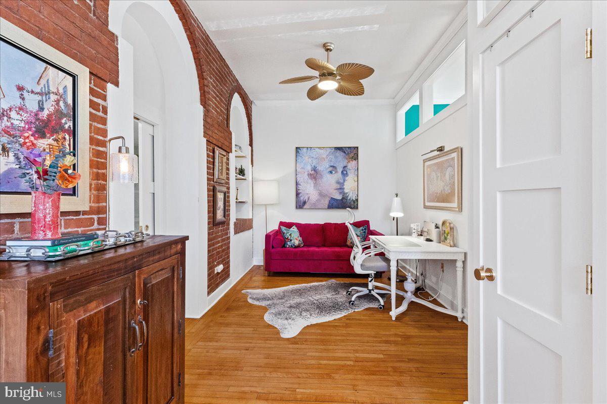 8 Academy Court Pennington, NJ 08534 - Photo 12 of 25 a living room with furniture and paintings on the wall