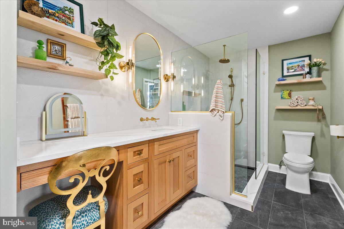 8 Academy Court Pennington, NJ 08534 - Photo 14 of 25 a bathroom with a toilet sink and mirror