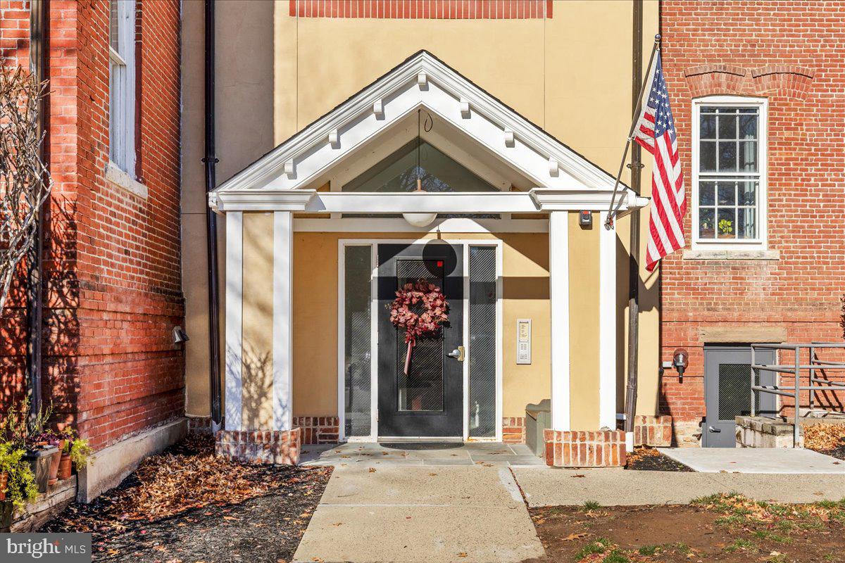 8 Academy Court Pennington, NJ 08534 - Photo 19 of 25 a view of a brick house with large windows