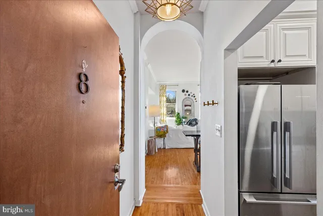 a view of hallway with livingroom and furniture