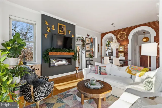 a living room with furniture and a table