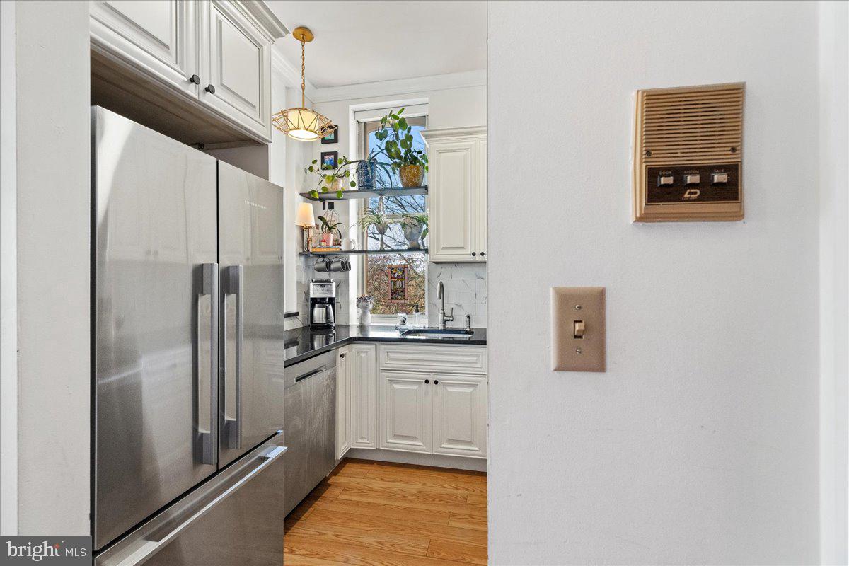 8 Academy Court Pennington, NJ 08534 - Photo 10 of 25 a kitchen with stainless steel appliances a refrigerator and a stove