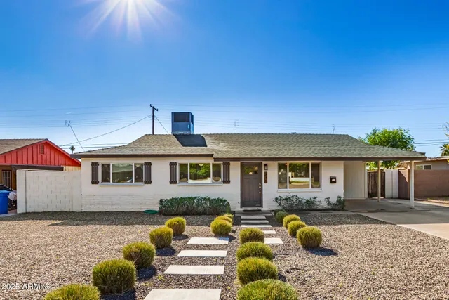 a front view of a house with patio