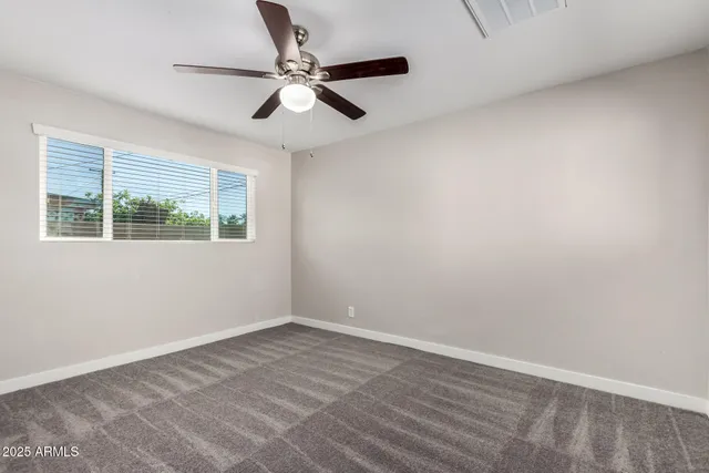 a view of kitchen and utility room with wooden floor